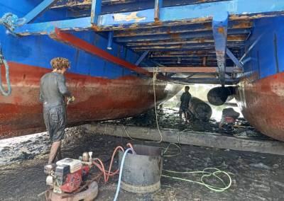 The SEA People Boat Drydock In the Mud Cleaning and Repairing Hulls 2Reef Restoration Coral Gardeners Raja Ampat